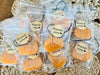 Orange pumpkin shaped car freshies in clear bags with thank you tags