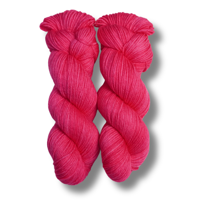 Two skeins of bright pink yarn on a white background