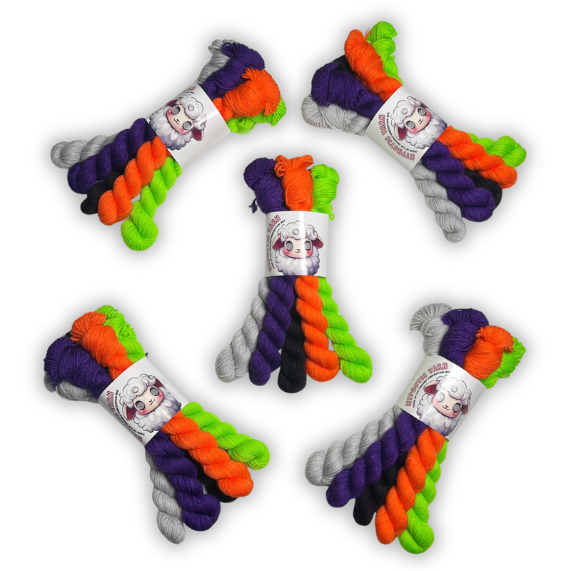 Five October 2026 Staff Pick fingering mini sets, each with five 20g skeins in purple, orange, lime green, black and light gray