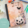 Pastel jack-o'-lantern composition notebook cover with butterflies