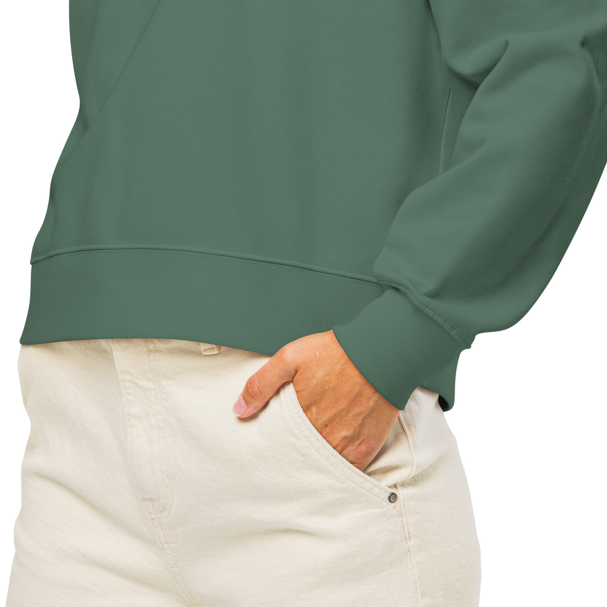 Close-up of the dark green NeuroSpicy sweatshirt fabric and ribbed cuff