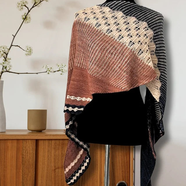 Blossoming Garden shawl on a dress form, warm rose and cream with dark stripes