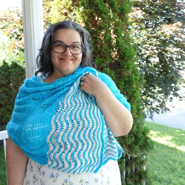 Tonia wearing the Party Favor shawl, bright turquoise lace with wavy stripes